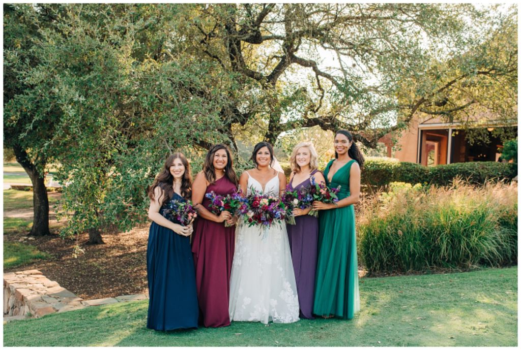 bridal party photo bridesmaids wearing jewel toned dresses