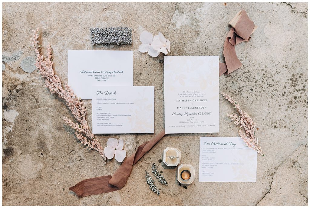 wedding details - blush ribbon, rings, wedding invitations 