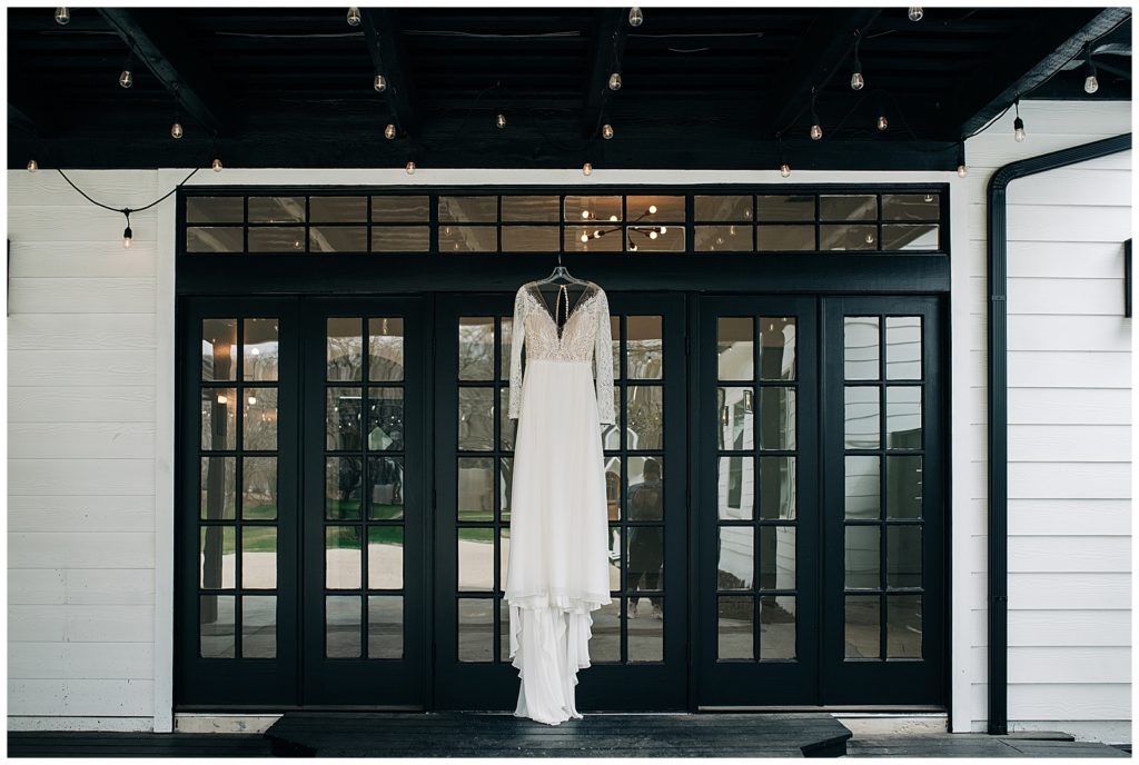 brides wedding dress hanging up at the emerson venue in texas