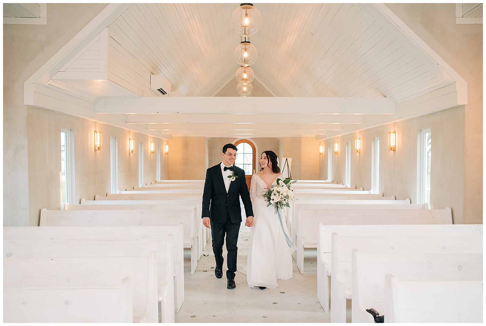 bride and groom holding hands in a chapel on their wedding at emerson venue