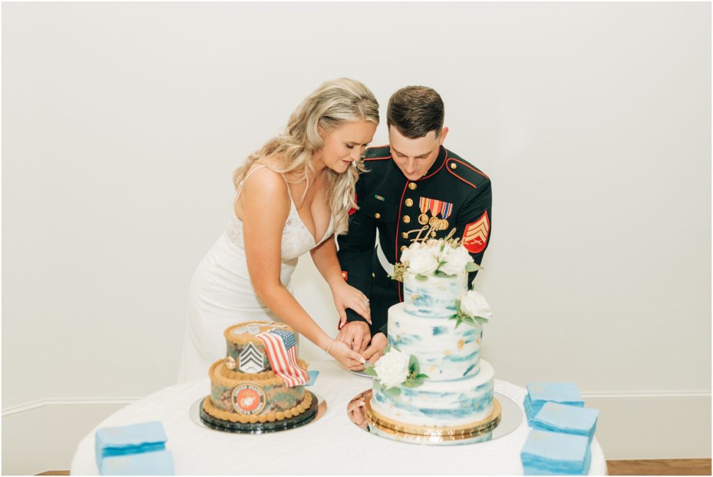 bride and groom cutting wedding cake at the Aristide venue in texas