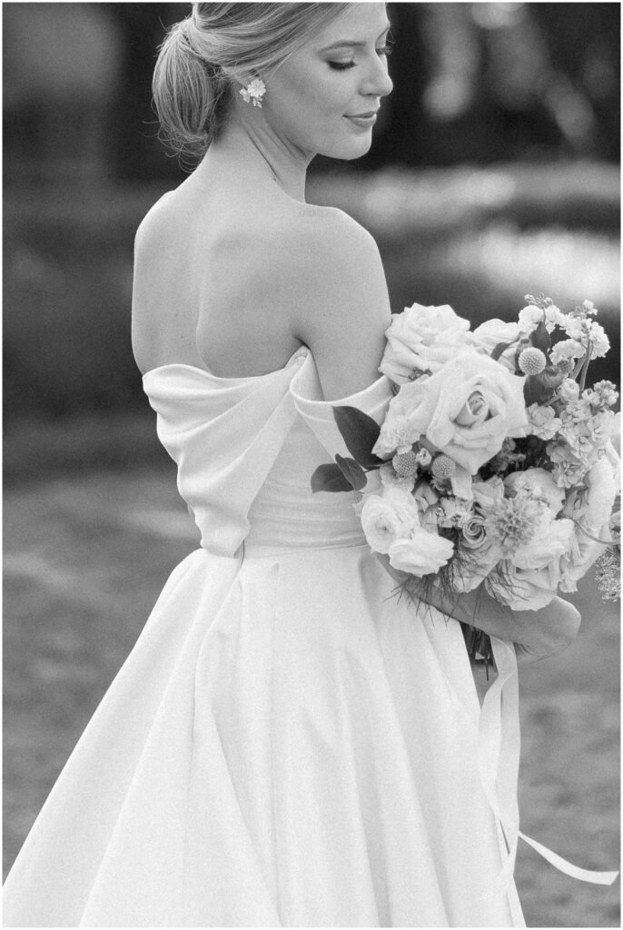 black and white photo of bride in gown at flippen park 